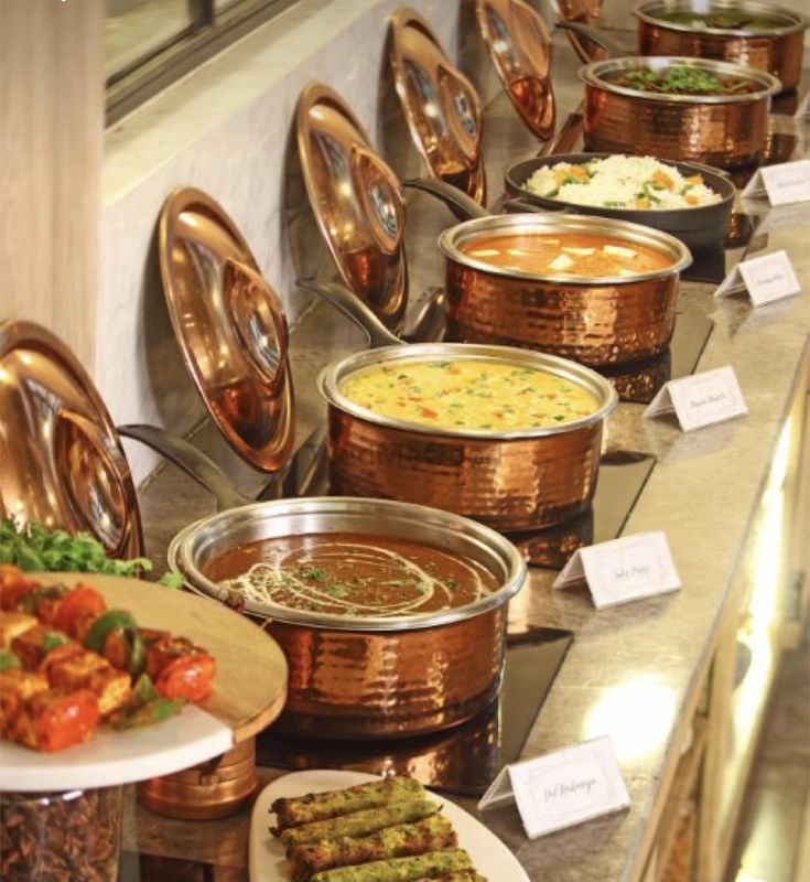 Indian buffet catering with copper handi pots